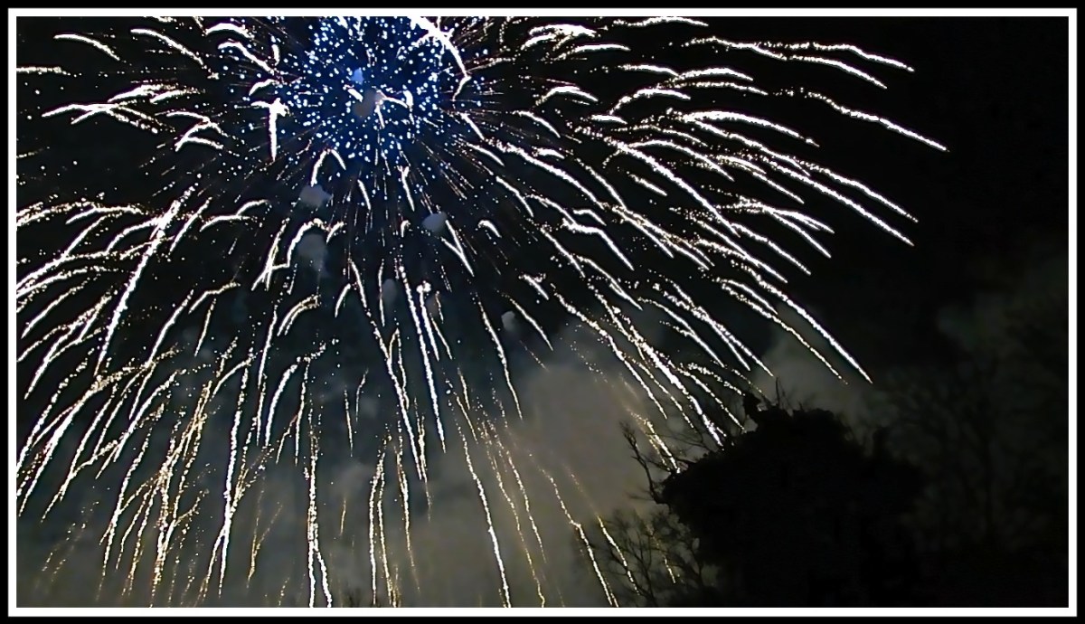 an exploding firework filing the whole image with the smoke still visible