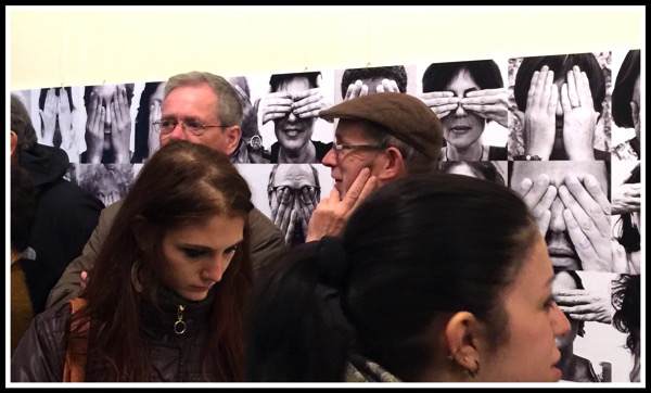 Art Senses Entrance with the posters in the background behind people gathering