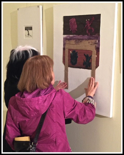 Couple of people touching the art