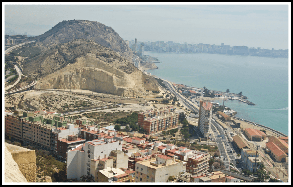Alicante 4.png A view looking out from the top of the castle down onto the coastline of Alicante