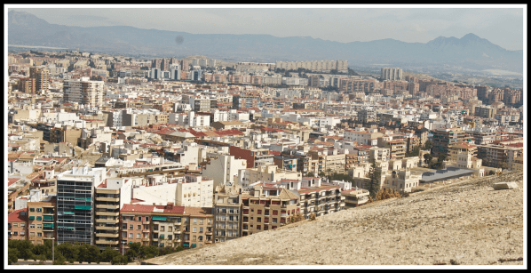 Alicante 4.png A view looking out from the top of the castle down onto the coastline of Alicante